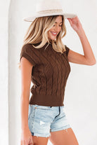 Side view of brown cotton knit top with cable pattern and crew neckline.

