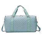 AVAH-Weekend Bliss Quilted Travel Bag in blue featuring a timeless design with vegan leather accents, Exterior open side pocket, luggage/trolley sleeve, shoe compartment, zip pocket and gold hardware
