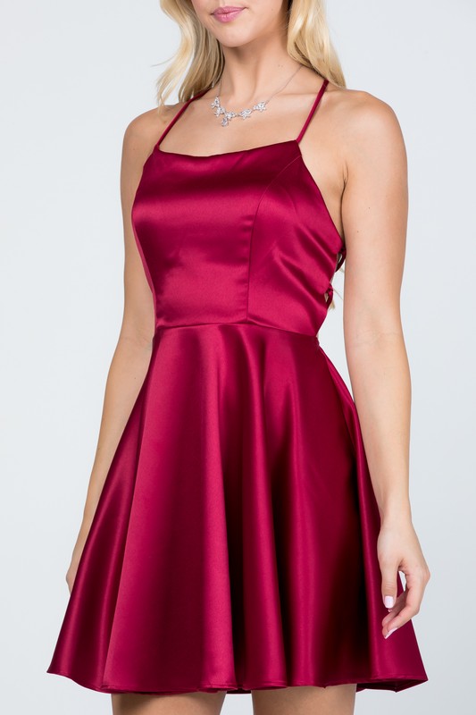Burgundy skater dress with thin straps and flared skirt front view
