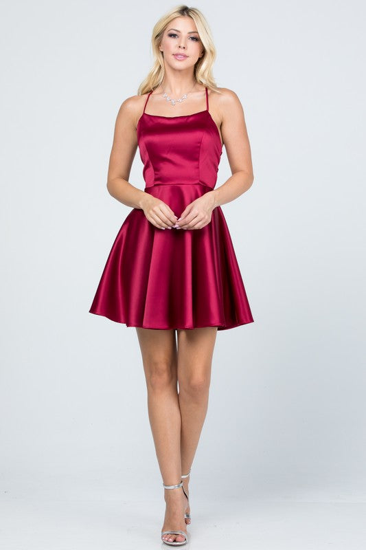 Burgundy skater dress with thin straps and flared skirt front view
