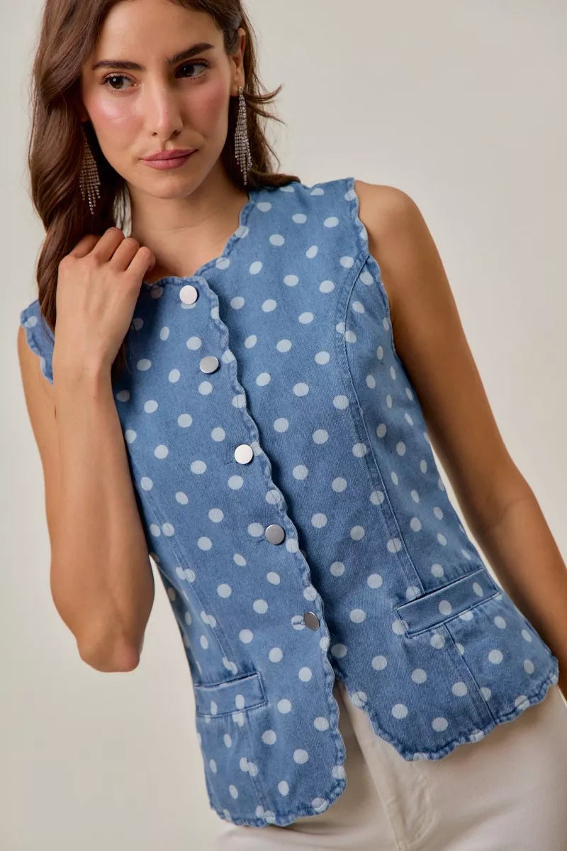 Sleeveless polka dot denim vest with snap button front closure
