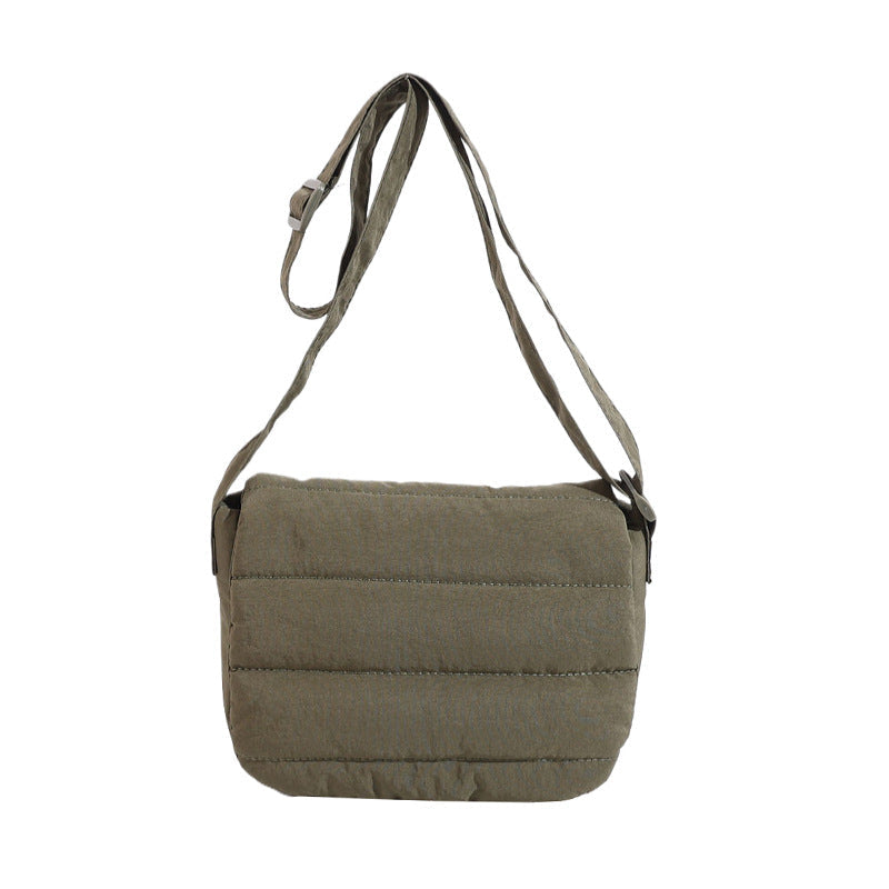Green shoulder bag on a white background