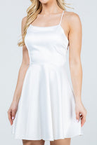 White skater dress with thin straps and flared skirt front view