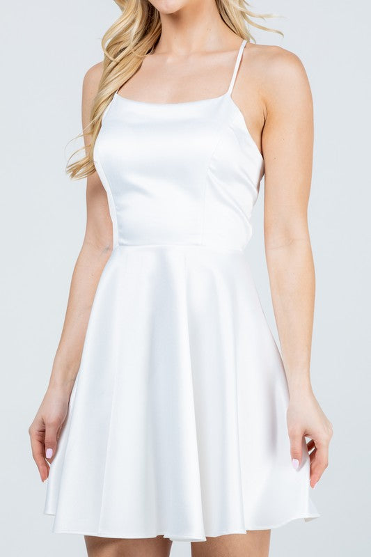 White skater dress with thin straps and flared skirt front view