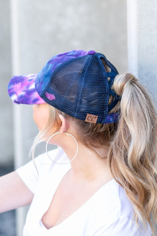 Navy tie dye ponytail cap showing adjustable criss cross back
