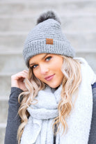 Light gray bouclé knit hat with faux fur pom, front product view
