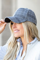 Side view of gray plaid knit flannel baseball hat with soft texture and structured crown.
