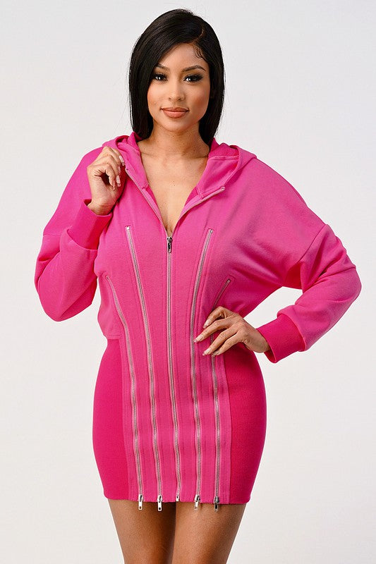 Pink zip hoodie dress styled with hood and long sleeves
