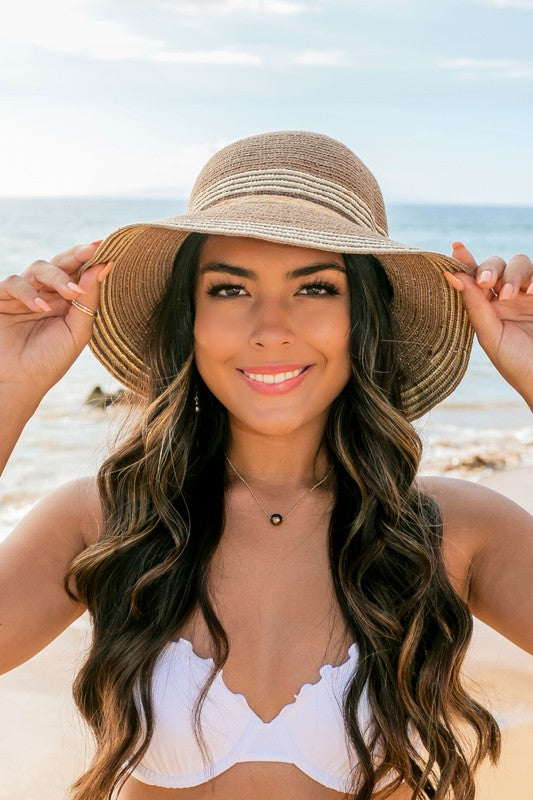 Neutral striped straw sun hat front view with wide brim
