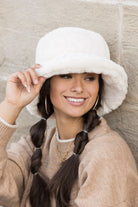 Model wearing cream plush bucket hat, soft faux-fur texture close-up-AVAH