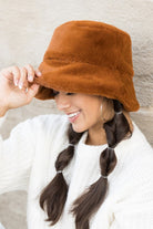 Side profile of camel faux-fur bucket hat

