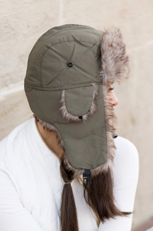 Olive faux fur aviator hat with quilted lining, side view

