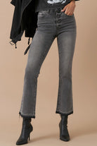 Cropped hem detail showing raw edge and slight flare