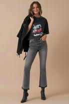 Model wearing grey high-rise crop boot jeans with black graphic tee – front view