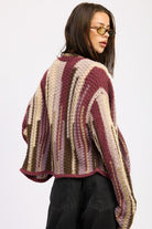 Back view of burgundy striped cardigan showing oversized relaxed fit and knit texture

