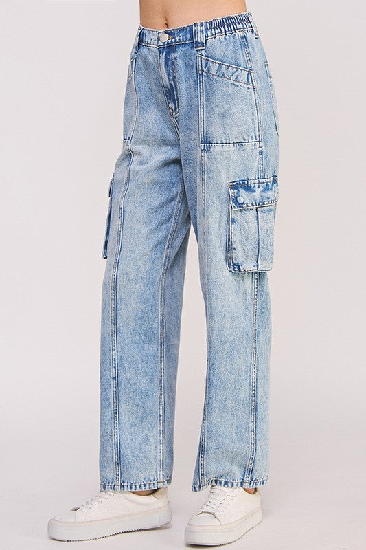 Side view of light blue baggy jeans with cargo pockets on a white background