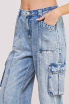 Close up of cargo pockets and high waist detail of ankle length jeans