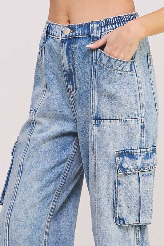 Close up of cargo pockets and high waist detail of ankle length jeans