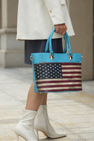 American flag tote in turquoise with gold accents, styled with white boots