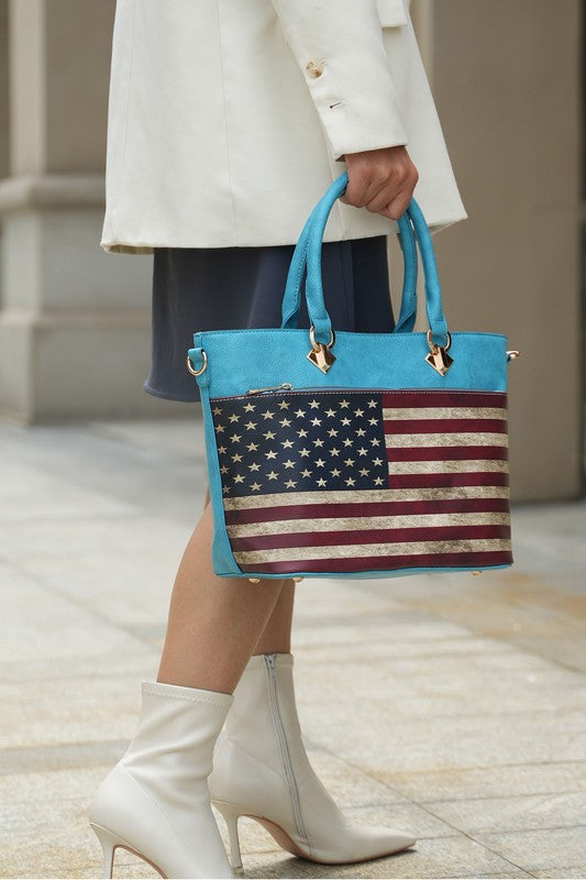 American flag tote in turquoise with gold accents, styled with white boots