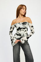Front view of fitted off-shoulder floral top with flared sleeves
