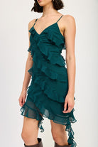Close-up front view of emerald green sleeveless ruffle mini dress with a flirty hem