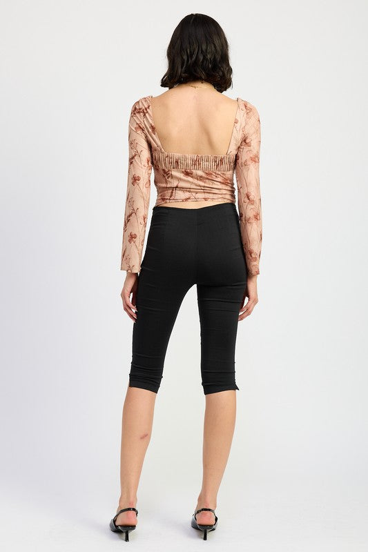 Back view of long sleeve blouse showing ruched detail 