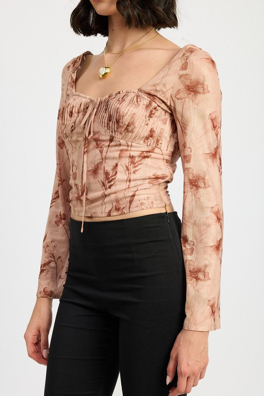 Close up detail of  the ruched sweetheart neck on the AVAH floral long sleeve top. 