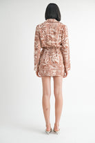 Back view of the shirt dress with elastic waist and long sleeves