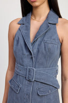 Close-up of dress collar, buttons, and wide denim belt