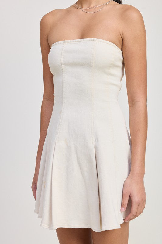 Close-up of ivory strapless mini dress showing structured bodice and seams