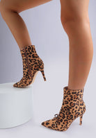 Leopard print ankle boots on a white background
