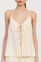 Close-up of front tie detail on ivory halter top