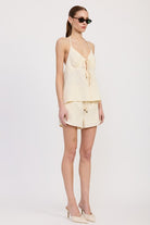 Angled side view of halter top showing flowy fit
