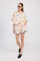 Full outfit featuring matching lounge shorts and boxy cropped shirt with a painterly print on a natural cotton base.
