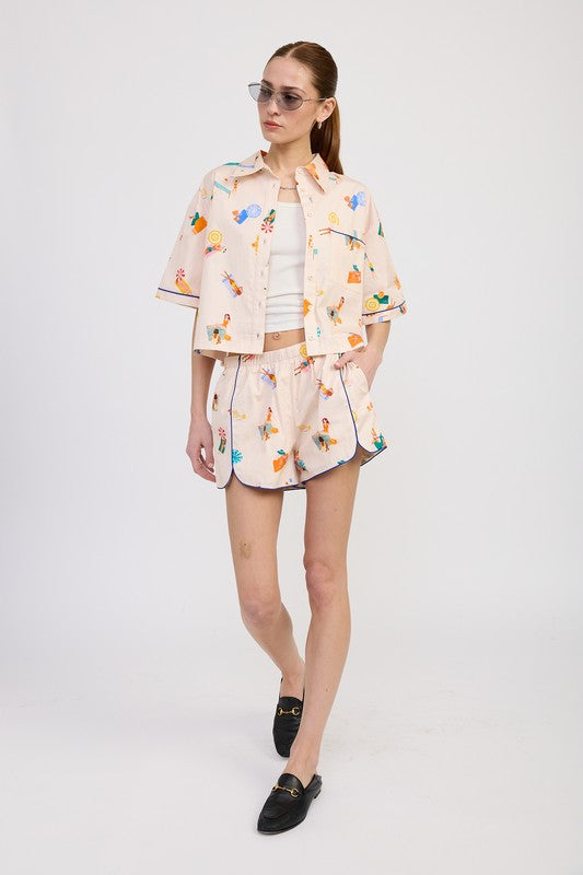 Full outfit featuring matching lounge shorts and boxy cropped shirt with a painterly print on a natural cotton base.