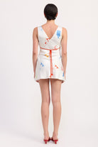 Back view of mini dress with low back and fitted silhouette