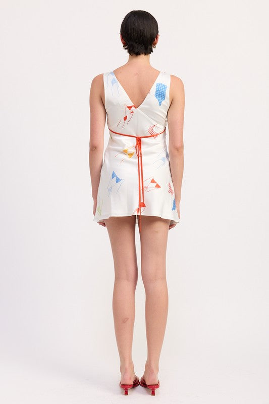 Back view of mini dress with low back and fitted silhouette