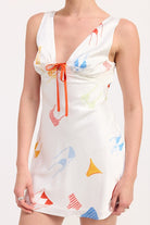Close-up of bust area showing tie detail and colorful bikini print