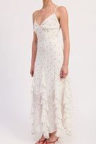 Close-up of white dress with black polka dots and wrap-style bodice