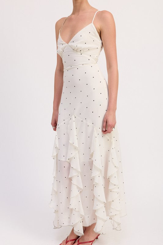 Close-up of white dress with black polka dots and wrap-style bodice