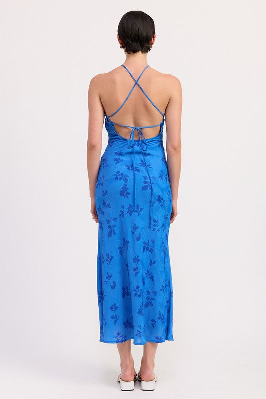 Back view of blue floral halter midi dress with open back and cross strap tie detail