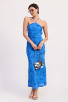 Full length blue floral midi dress with halter neckline and flowing hem