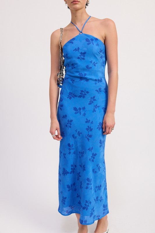 Close up of blue floral halter dress showing fitted bodice and delicate strap detail
