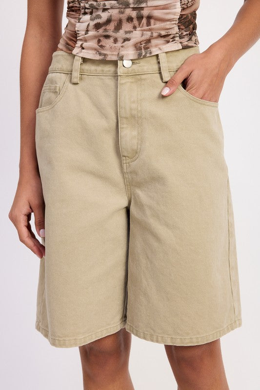 Close-up – front pocket and waistband details of sage cotton shorts