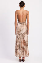 Back view showing low scoop back and adjustable straps on leopard slip dress