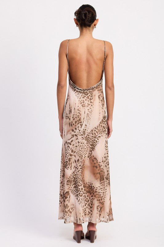 Back view showing low scoop back and adjustable straps on leopard slip dress