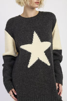 close-up of charcoal star sweater with ivory star detail
