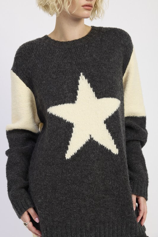 close-up of charcoal star sweater with ivory star detail
