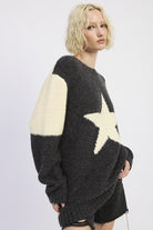 side view of charcoal and ivory star knit sweater
